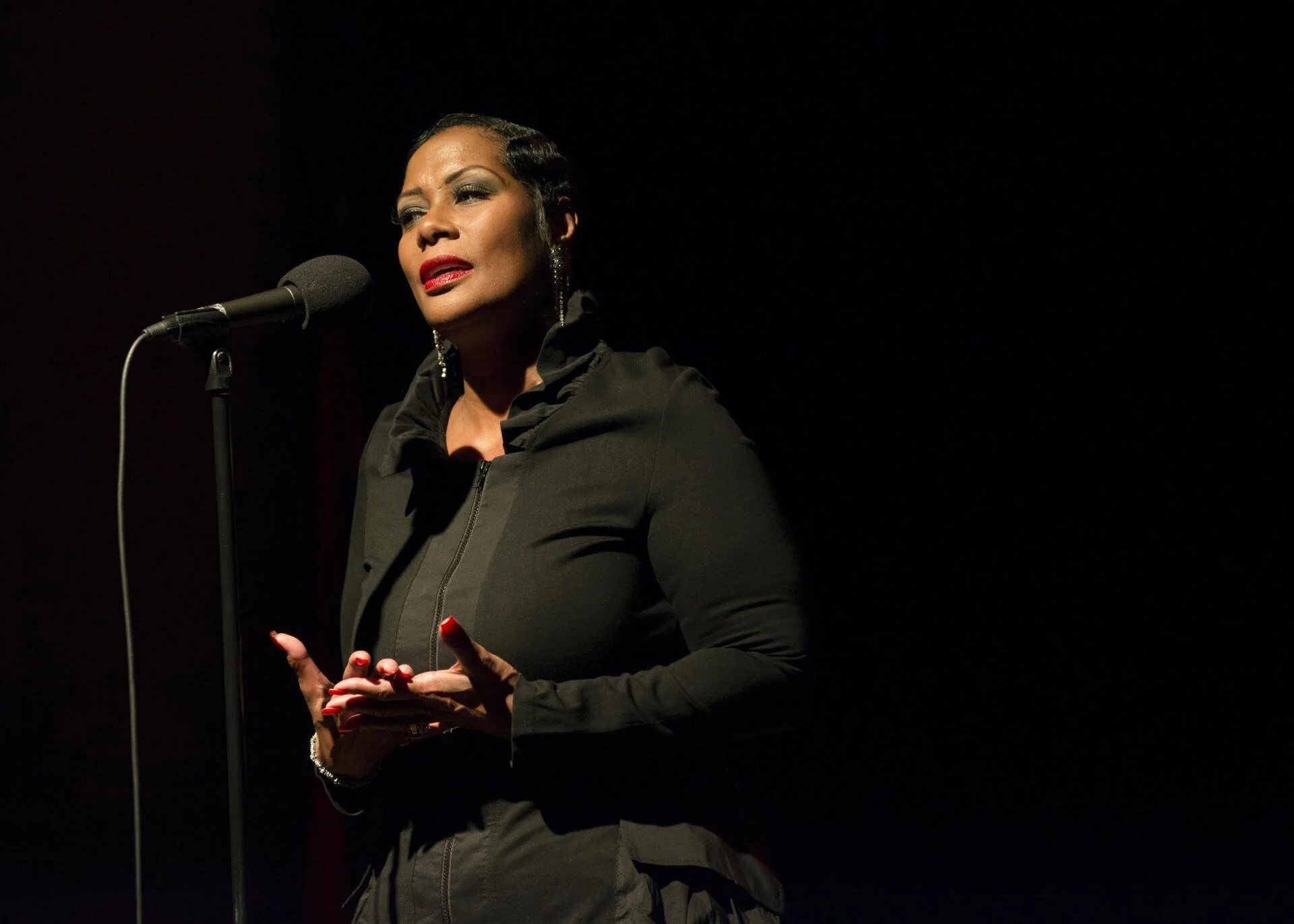 Monica Morgan speaking at the microphone