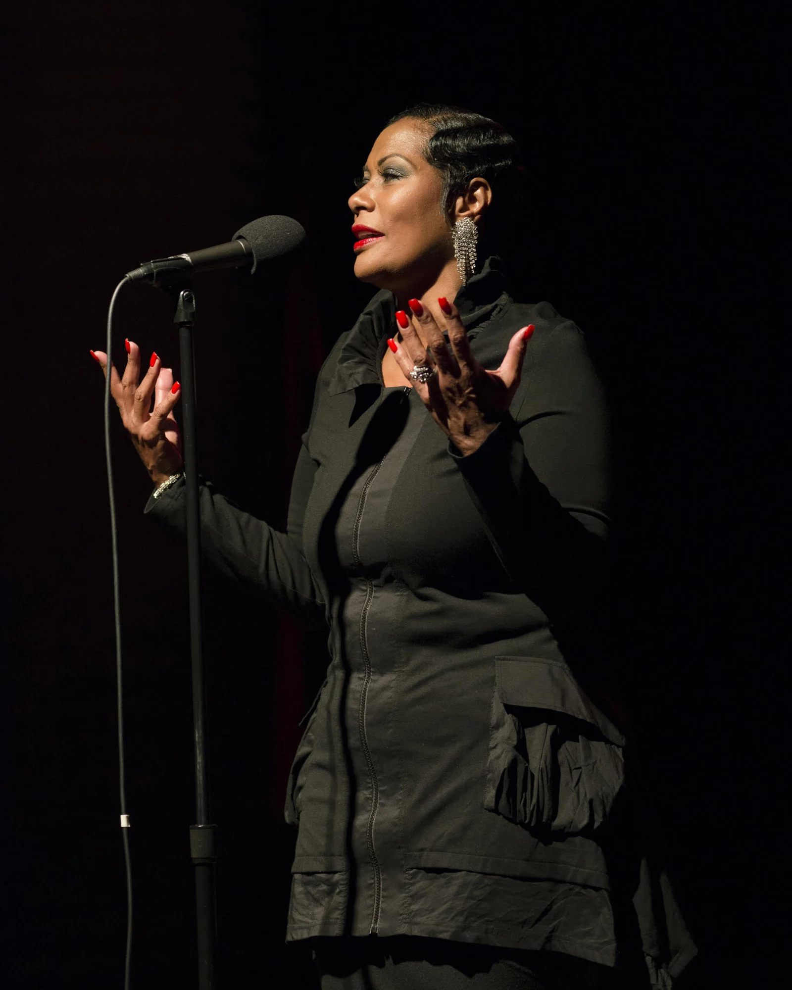 Monica Morgan speaking at the microphone